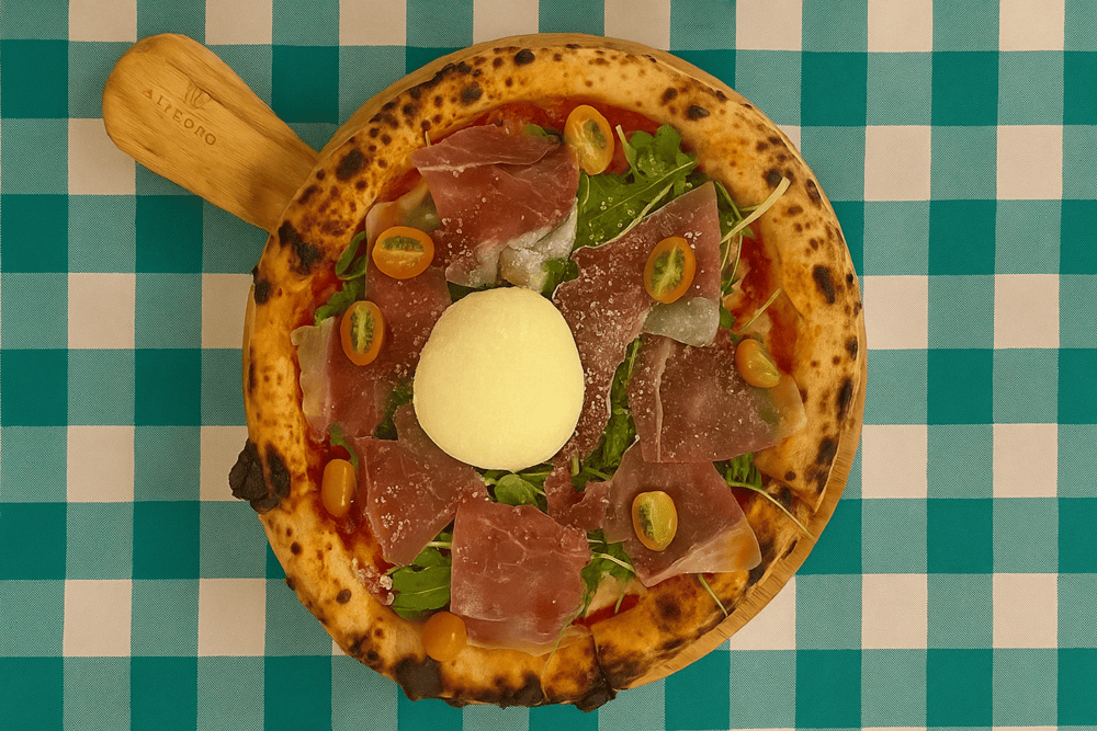 La Bottega welcomes diners with a rustic Italian charm and an open kitchen featuring a signature wood-fired oven